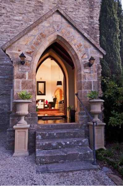 Small Church Conversion Creates Modern House behind Traditional Stone