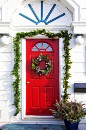 Outdoor Christmas Decorating with Green Garlands and Winter Holiday Wreaths